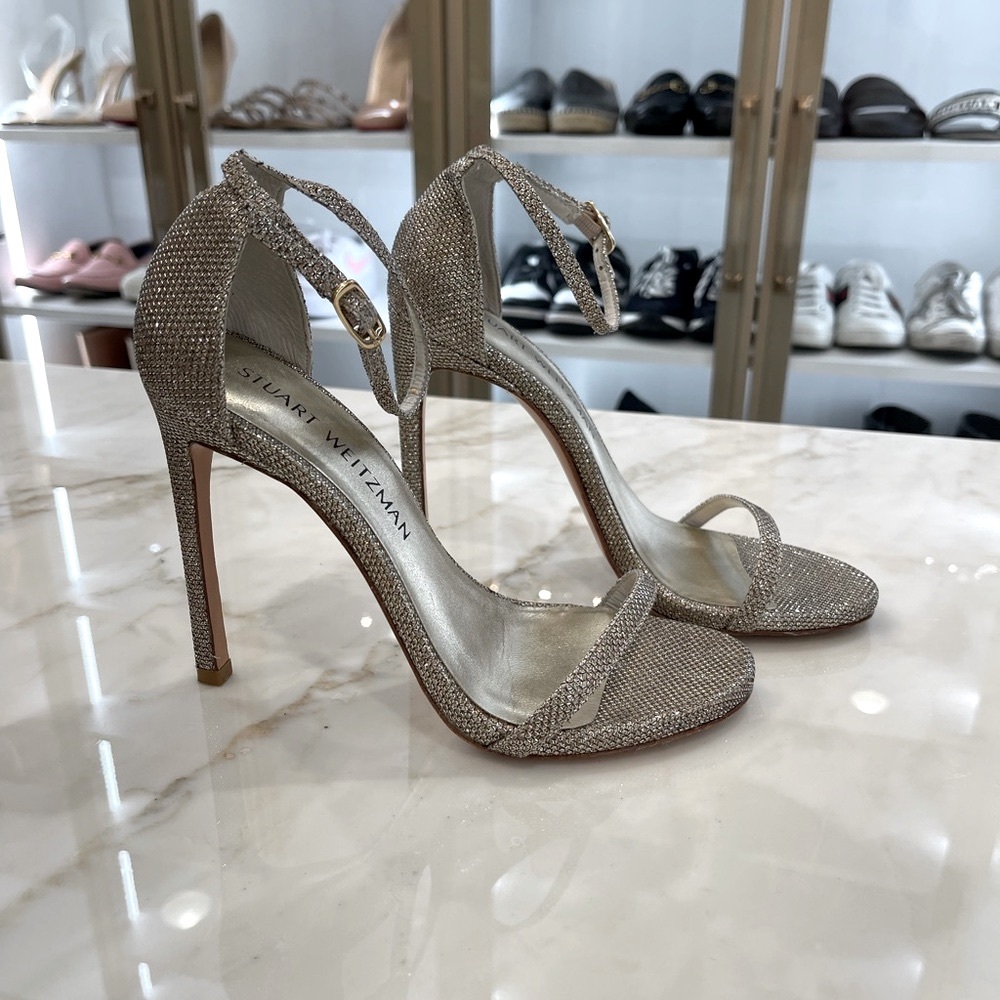 Stuart Weitzman  Nudistcurve Shimmery Ankle-Strap Sandals
In Platino